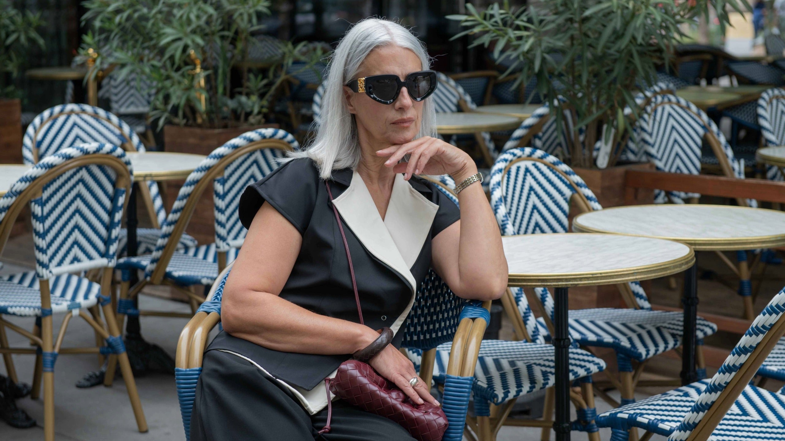 IKKHO tops collection hero image featuring refined collared tops with clean tailoring and quiet confidence