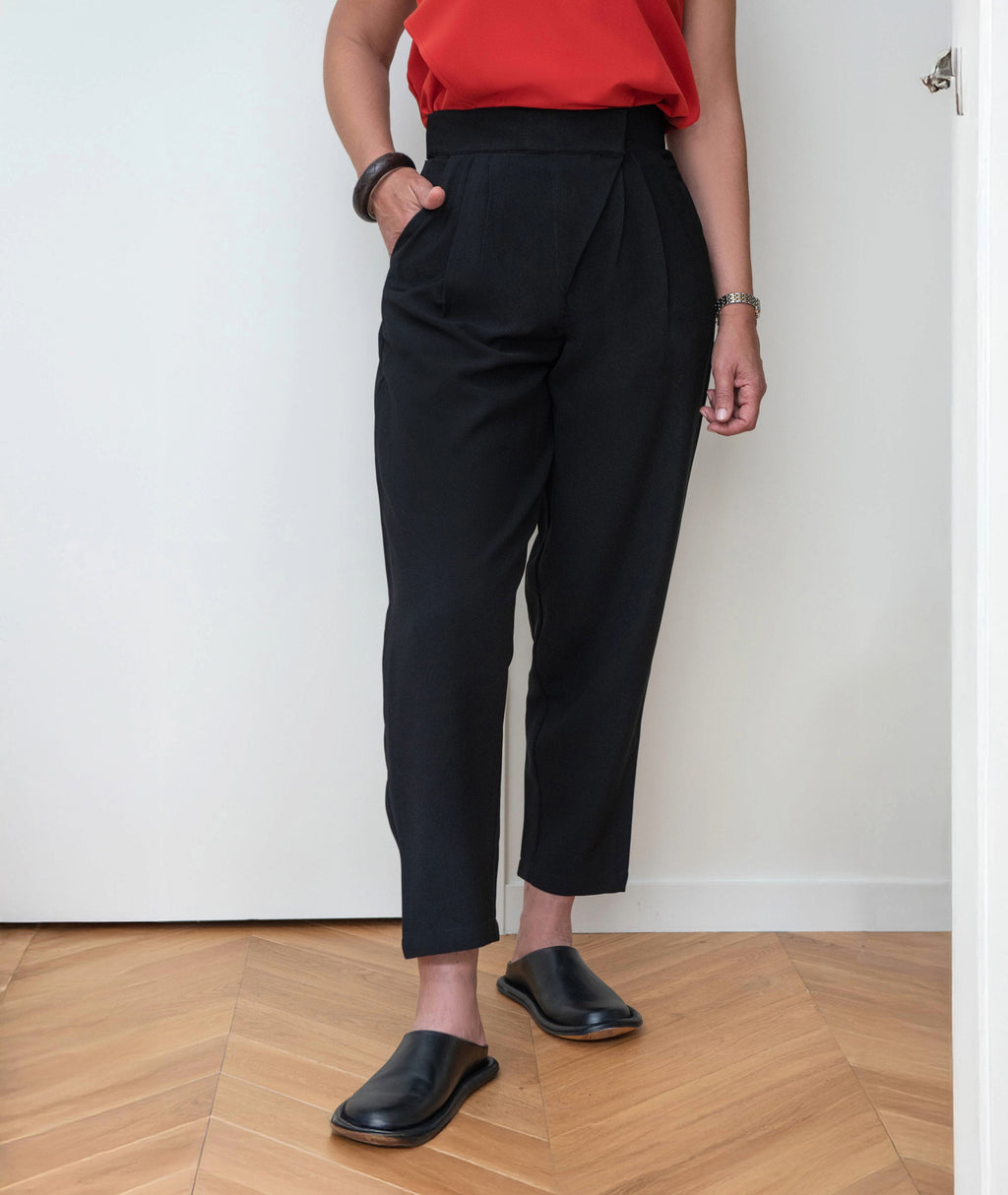 Angled front view of Balance Peg Trousers by IKKHO highlighting peg fit and clean tailored finish