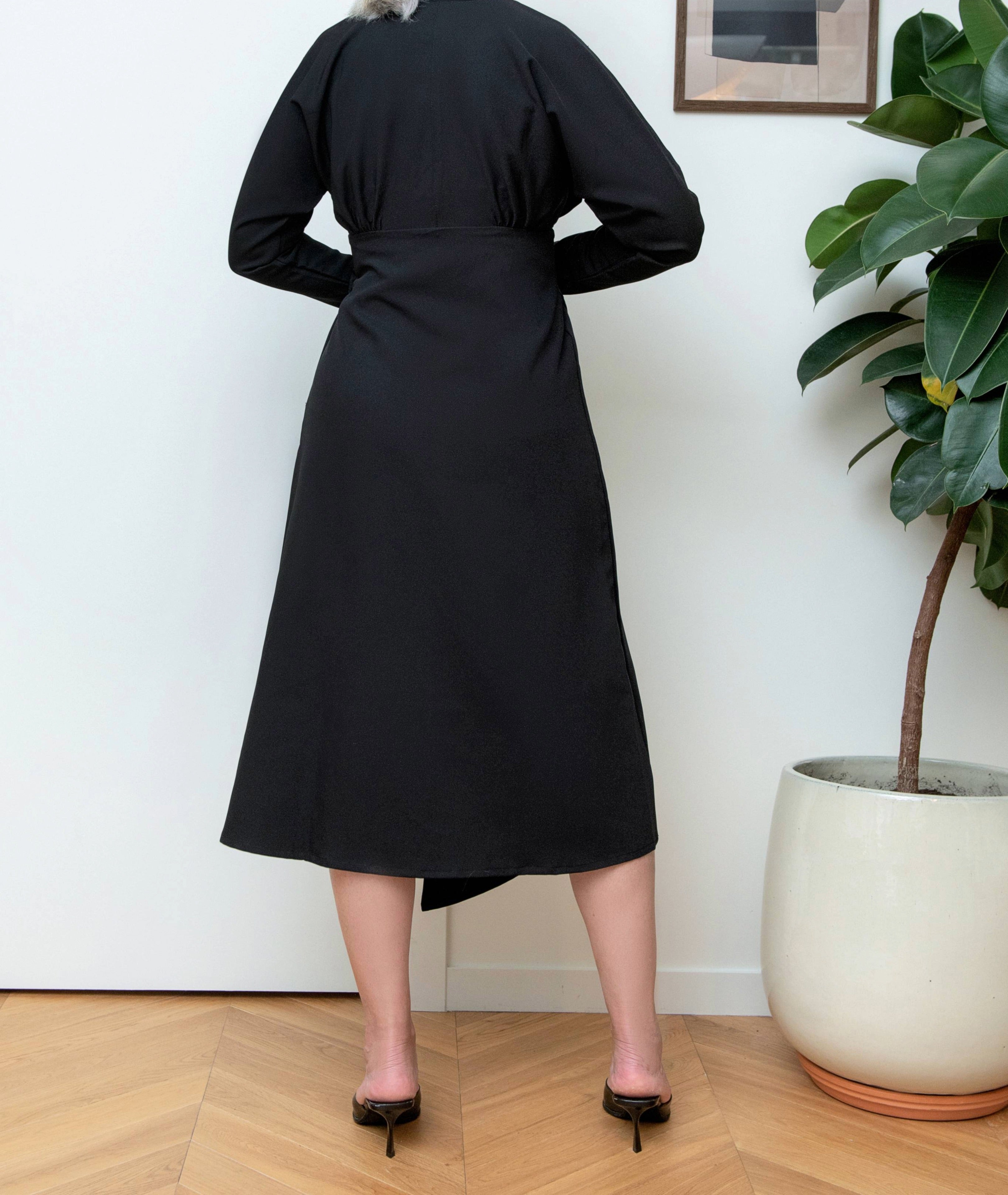 Back view of Drift Midi Dress by IKKHO showing clean midi length and long sleeves with slit detail
